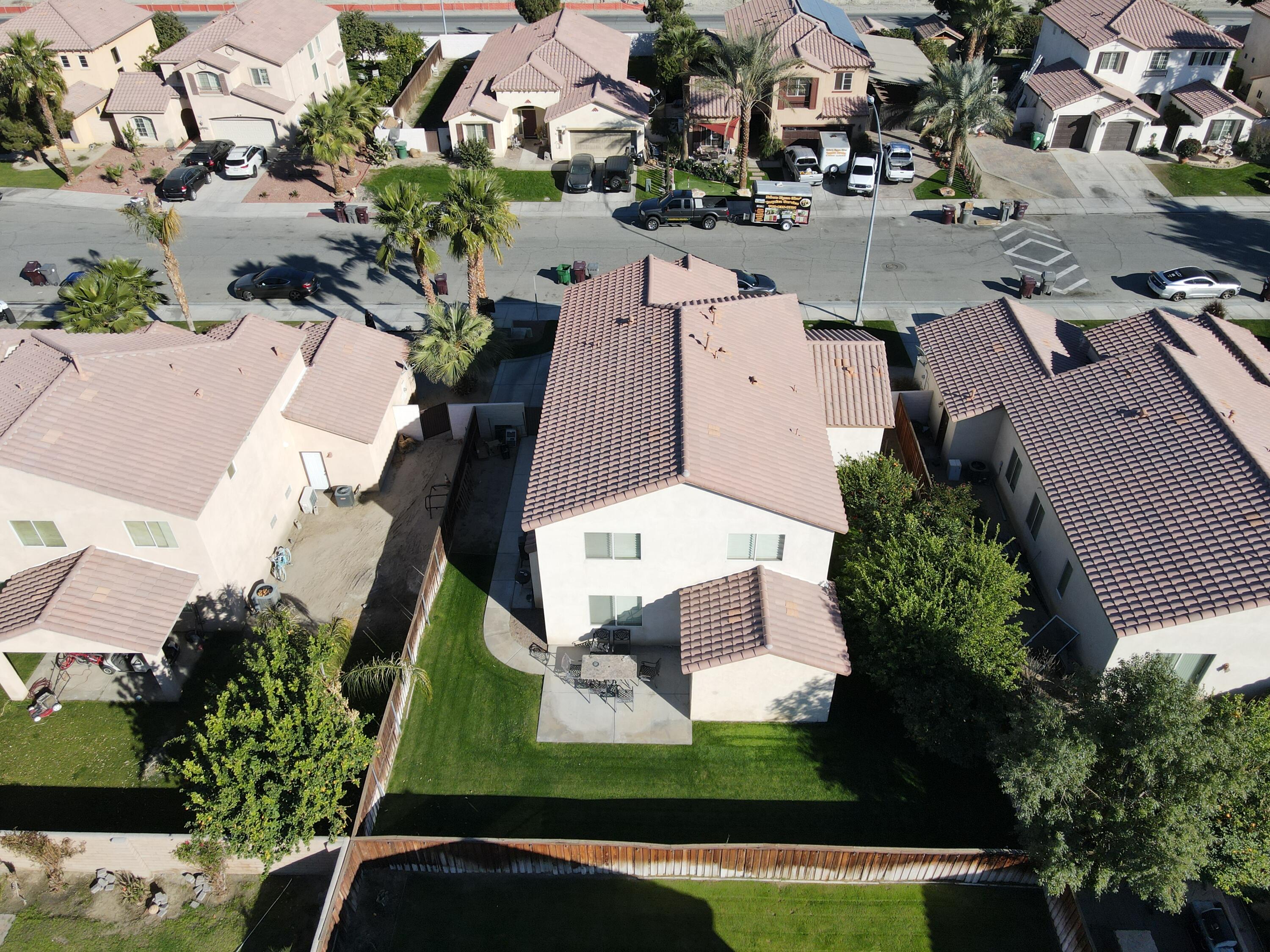 50083 San Solano Road Coachella, CA 92236 - Photo 4 of 6 an aerial view of a house with a garden and lake view