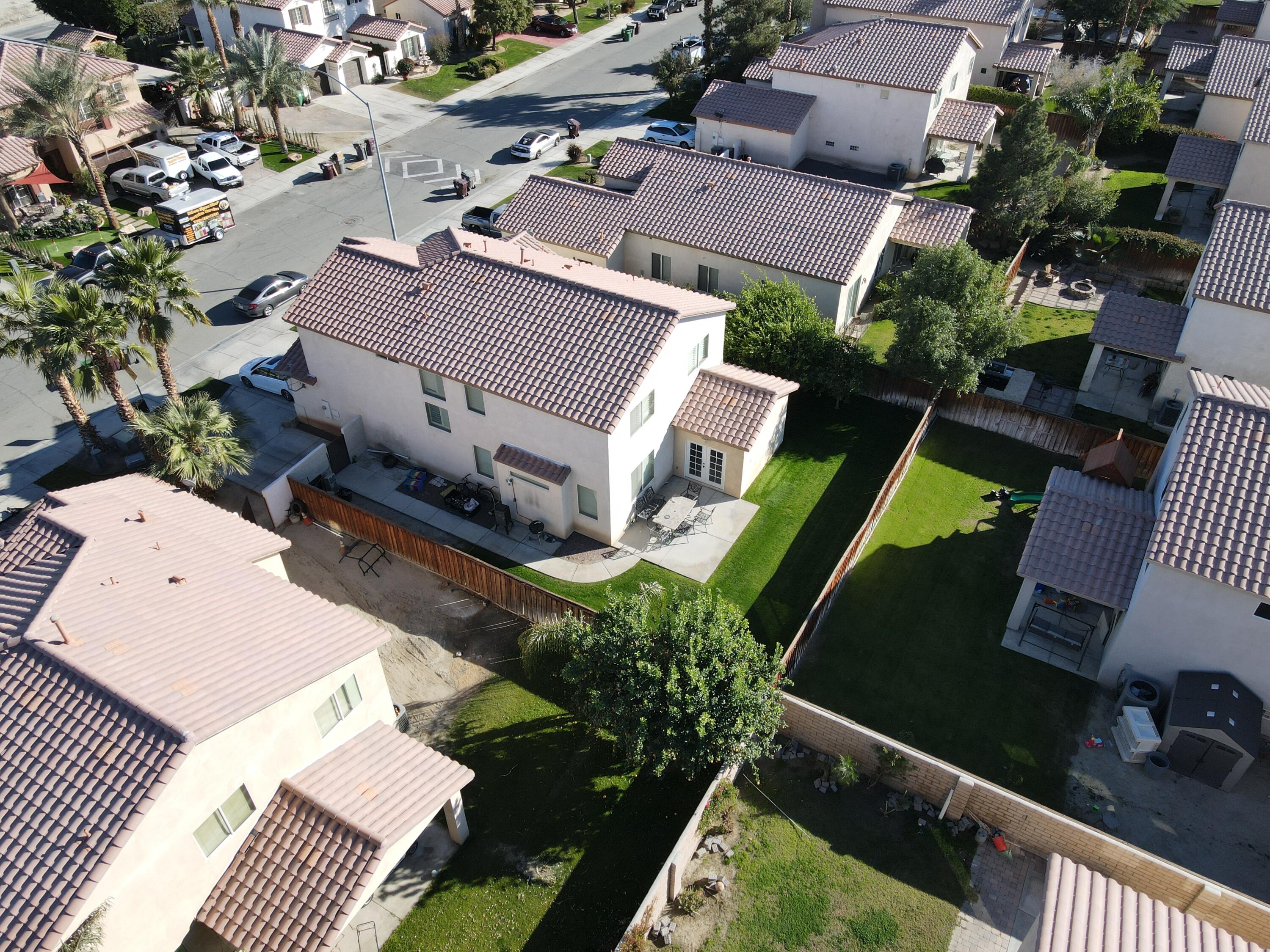 50083 San Solano Road Coachella, CA 92236 - Photo 5 of 6 an aerial view of a house with a garden and swimming pool