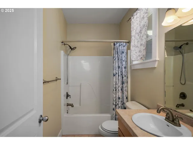 a view of a hallway to a livingroom