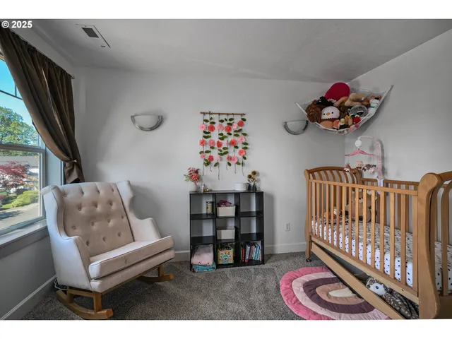 a bedroom with furniture and a window