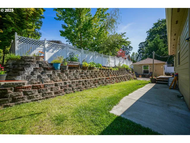 a backyard of a house with yard barbeque oven and outdoor seating