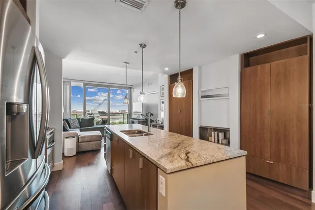 a kitchen with a sink stove and refrigerator