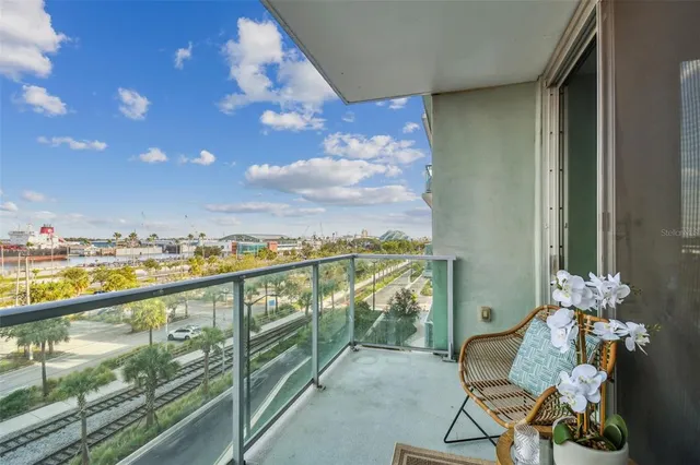 a view of a balcony with furniture