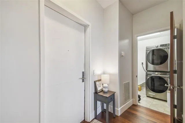 a view of a hallway with washer and dryer
