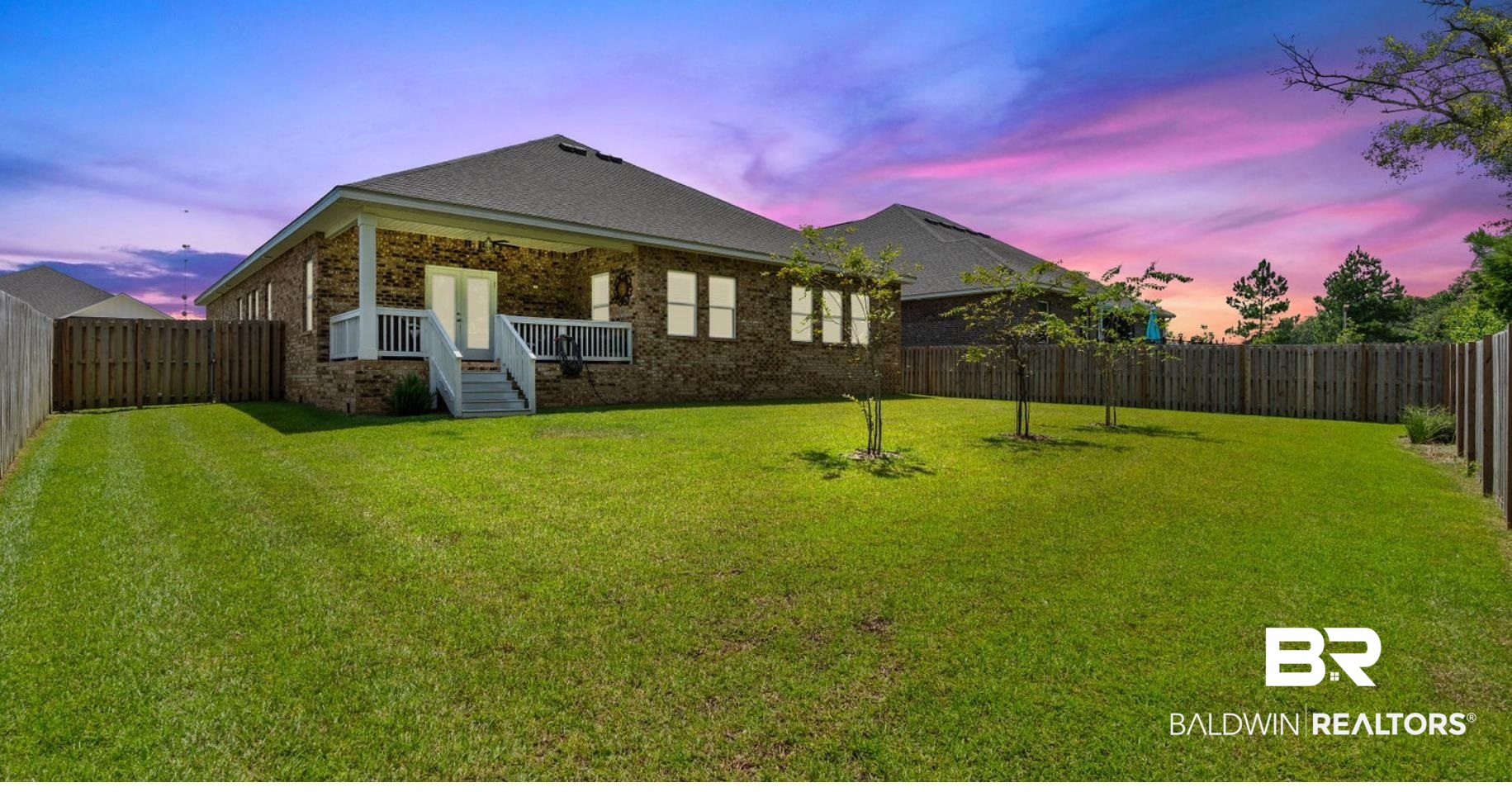 8841 Calverton Street Foley, AL 36535 - Photo 4 of 51 Back house at dusk featuring a lawn