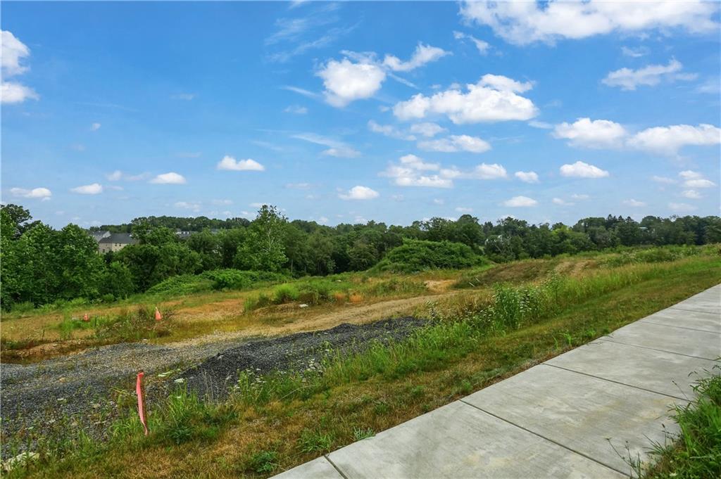 a view of a city street from a lake