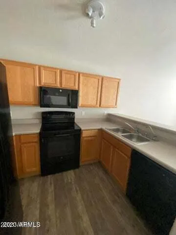 a kitchen with a stove and a refrigerator