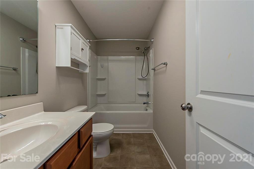 9019 Klein Road Fort Mill, SC 29715 - Photo 15 of 19 a bathroom with a sink a toilet and shower