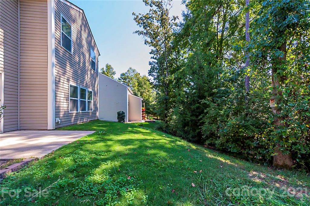 9019 Klein Road Fort Mill, SC 29715 - Photo 18 of 19 a view of a house with backyard and garden