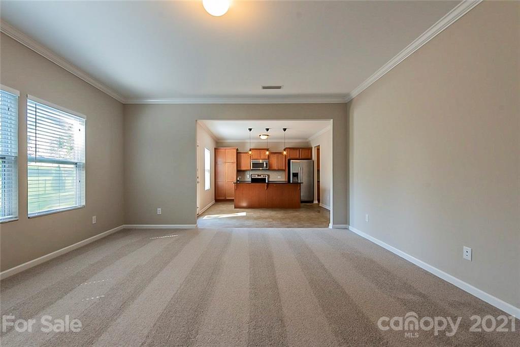 9019 Klein Road Fort Mill, SC 29715 - Photo 10 of 19 a view of a room with wooden floor and a window
