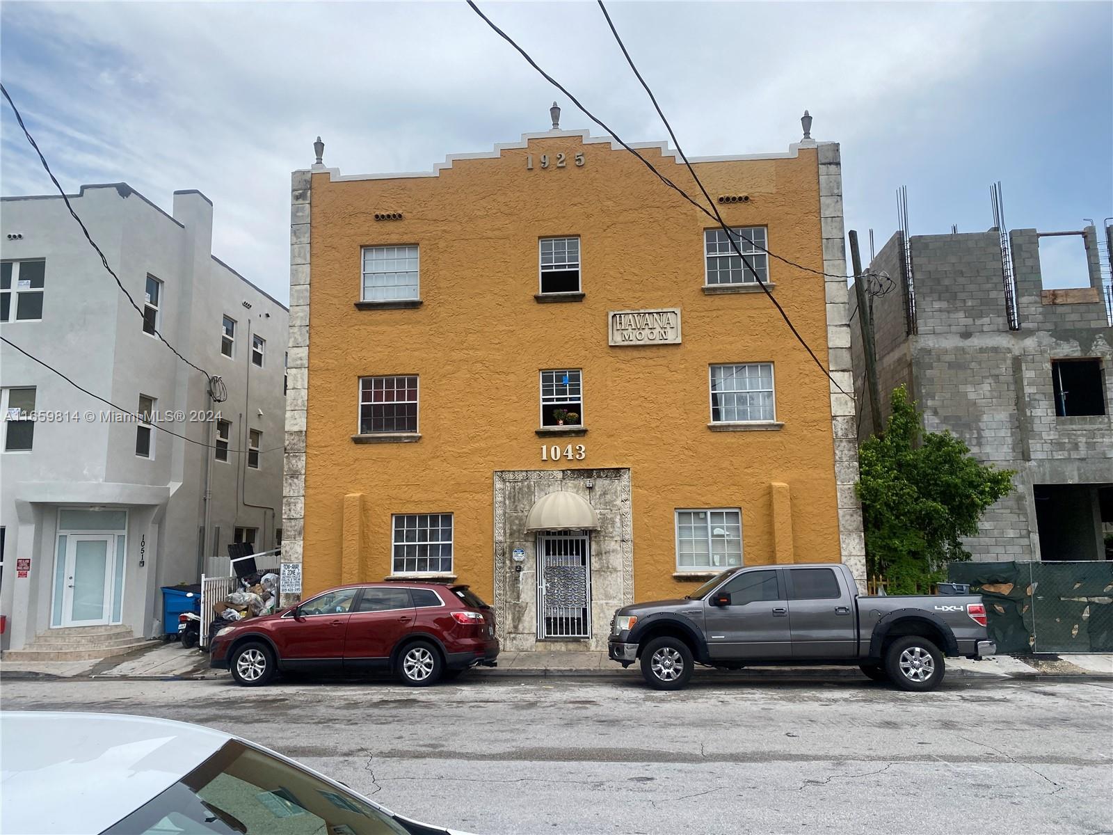 1043 Northwest 2nd Street, Unit 16 Miami, FL 33128 - Photo 1 of 17 a black car in front of a building
