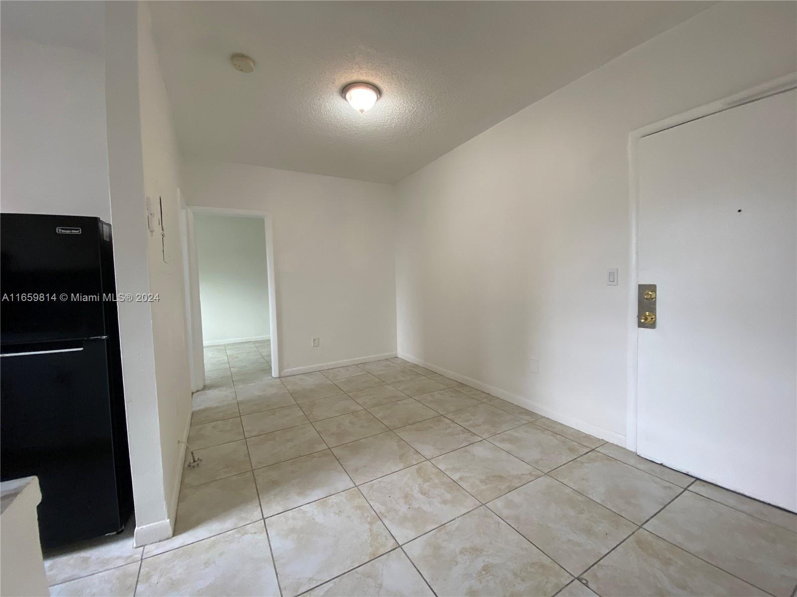 1043 Northwest 2nd Street, Unit 16 Miami, FL 33128 - Photo 14 of 17 a view of an empty room