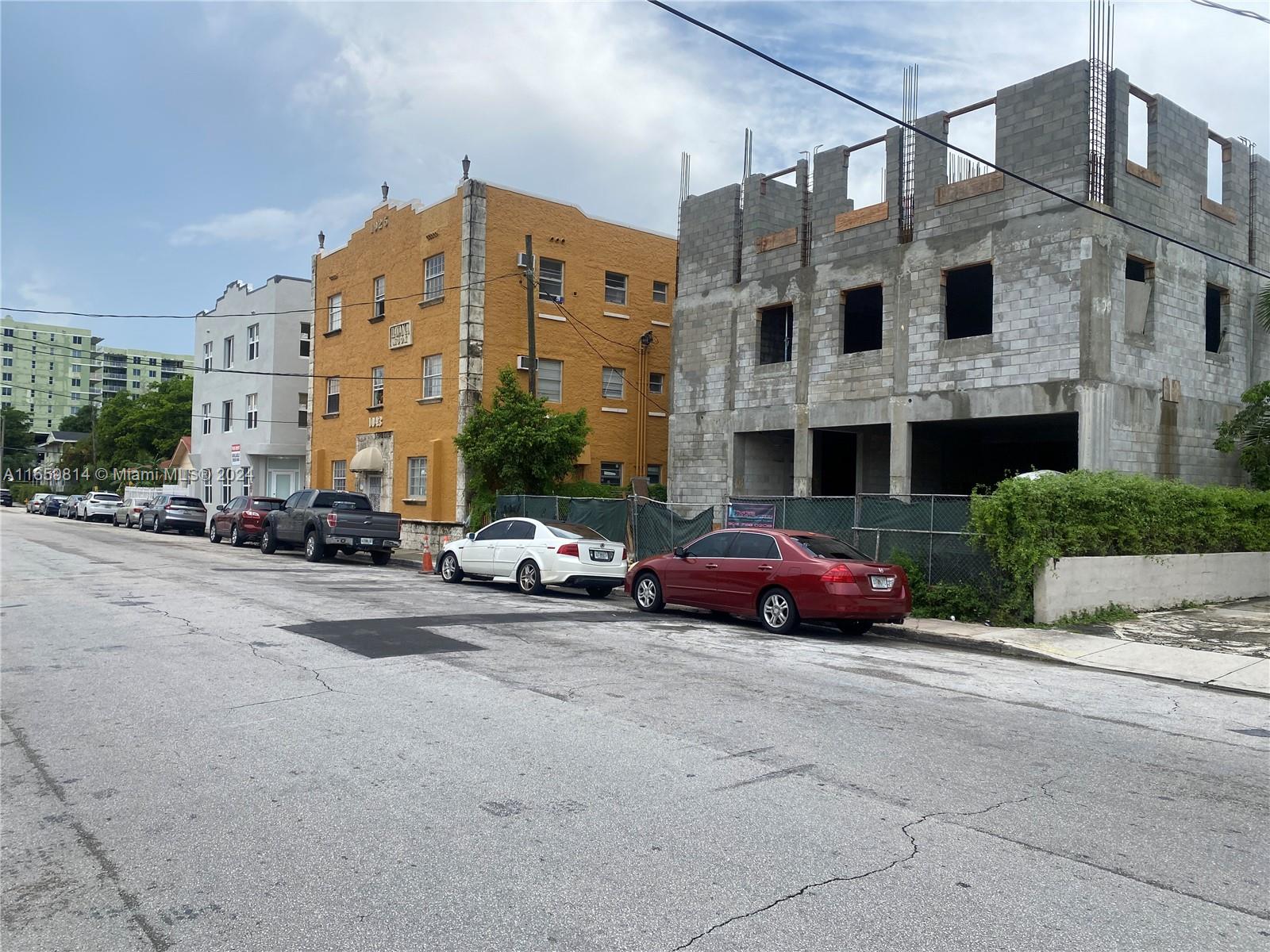 1043 Northwest 2nd Street, Unit 16 Miami, FL 33128 - Photo 8 of 17 a car parked in front of a building