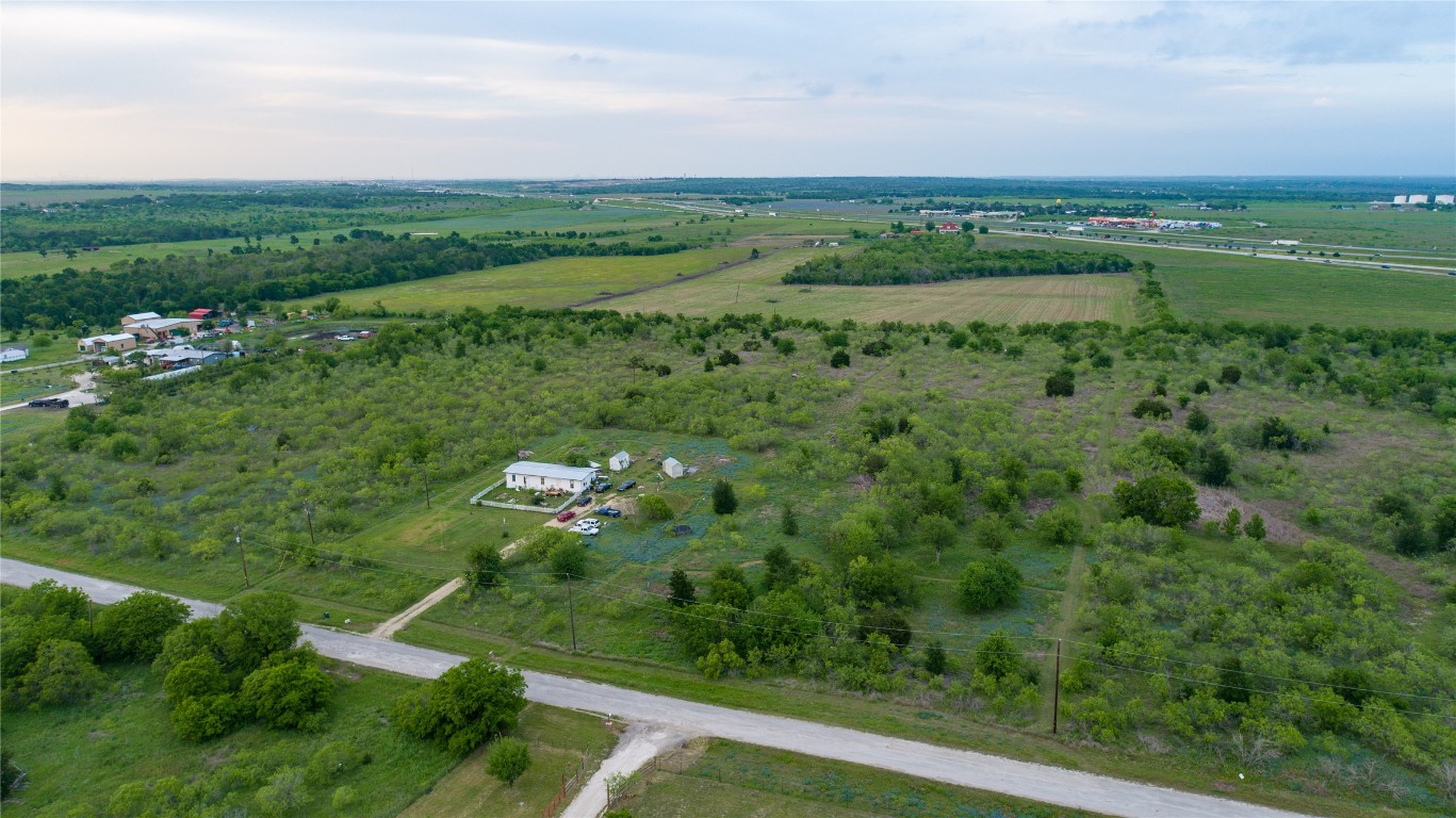 118 Ranchero Drive Buda, TX 78610 - Photo 3 of 21 a view of lake with green space