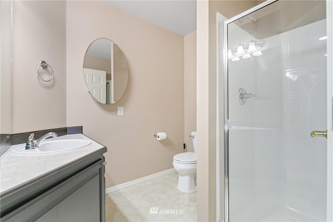 1127 185th Place Southeast Bothell, WA 98012 - Photo 13 of 25 a bathroom with a sink and a mirror