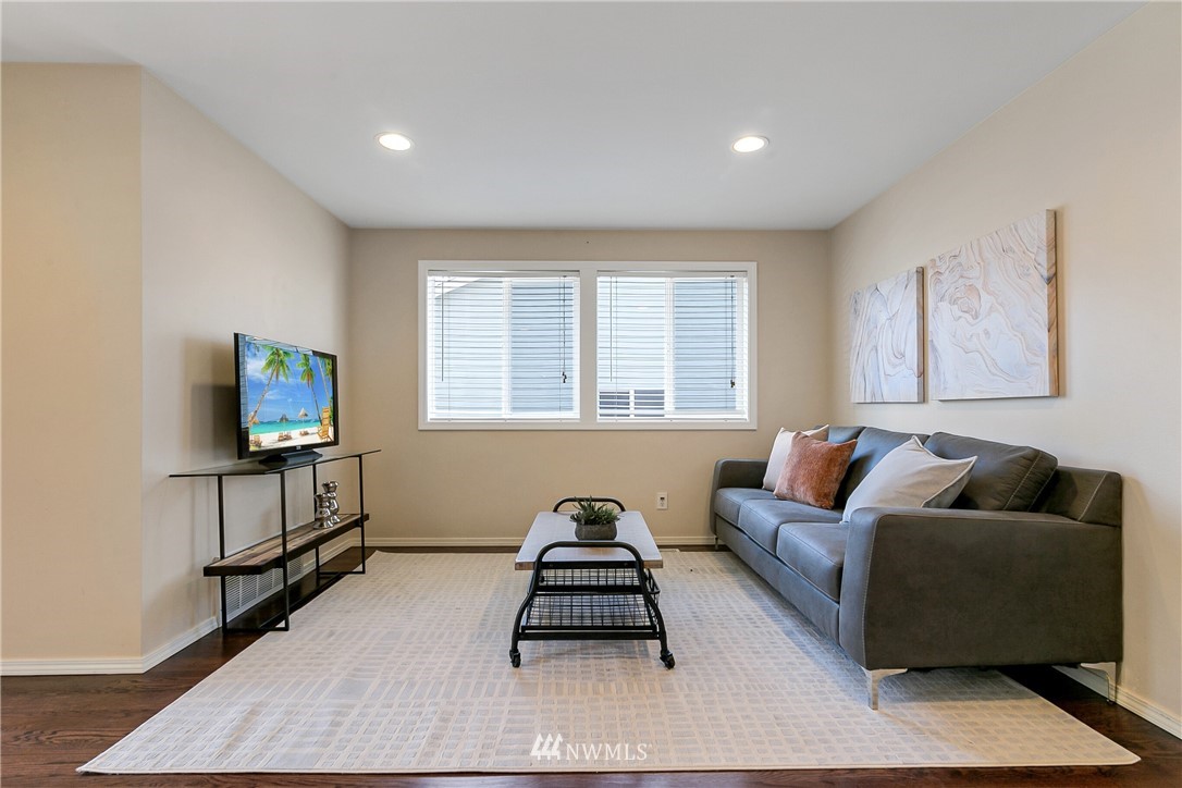 1127 185th Place Southeast Bothell, WA 98012 - Photo 14 of 25 a living room with furniture and a window