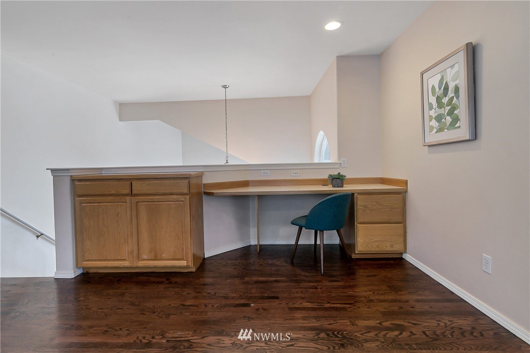 1127 185th Place Southeast Bothell, WA 98012 - Photo 15 of 25 a view of room with furniture and wooden floor