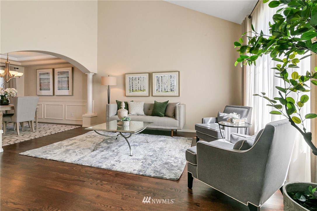 1127 185th Place Southeast Bothell, WA 98012 - Photo 3 of 25 a living room with furniture and a potted plant