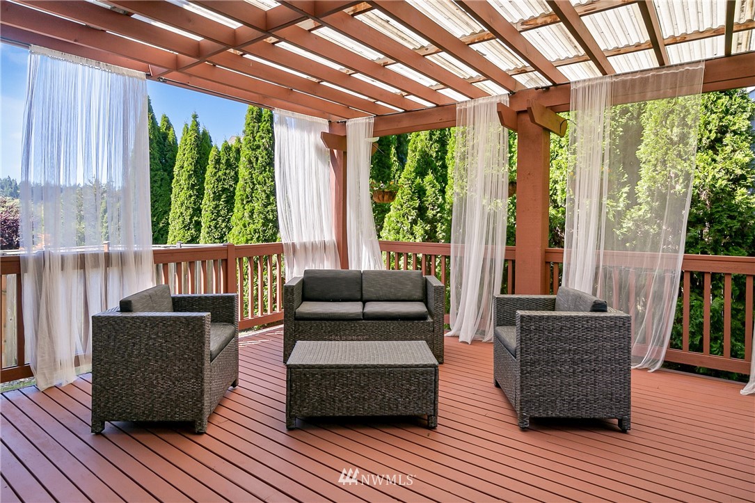 1127 185th Place Southeast Bothell, WA 98012 - Photo 24 of 25 a living room with furniture and wooden floor