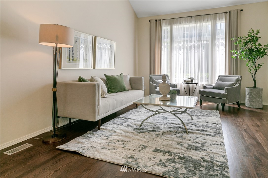 1127 185th Place Southeast Bothell, WA 98012 - Photo 4 of 25 a living room with furniture and a large window
