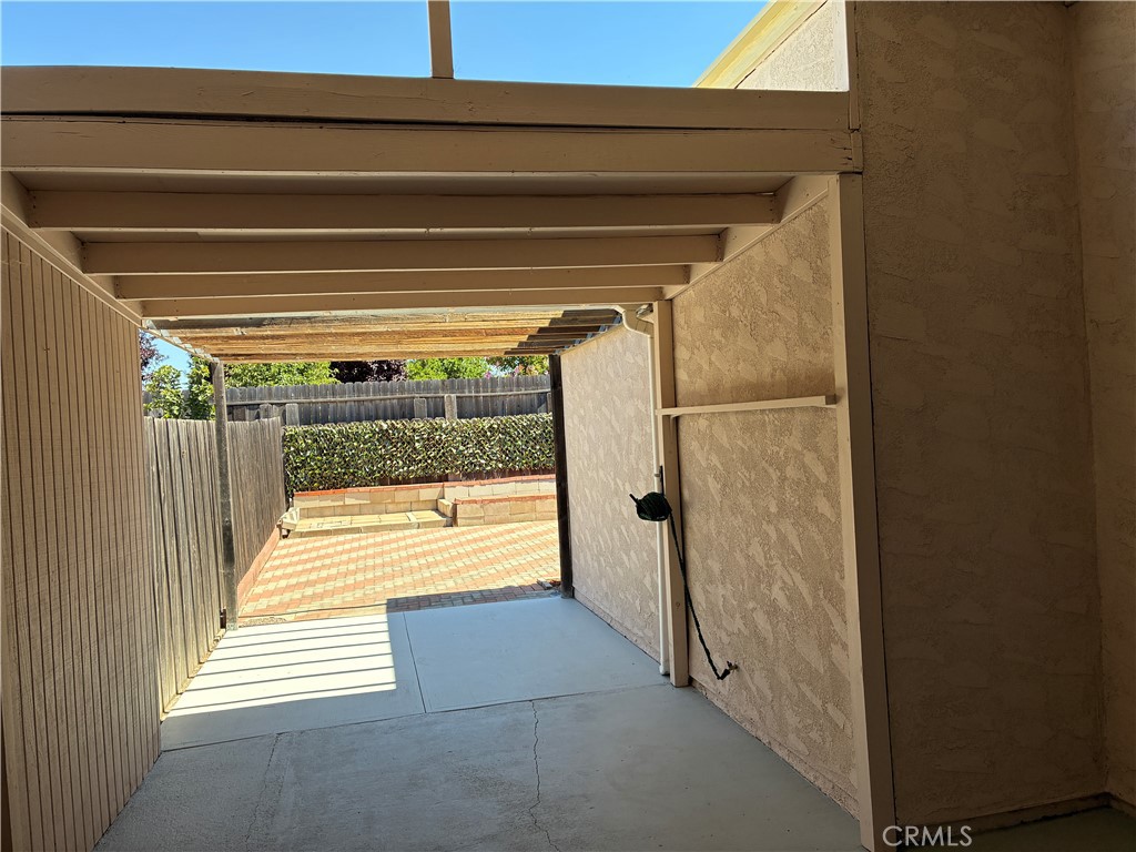 517 Queenanne Road Paso Robles, CA 93446 - Photo 10 of 18 Wonderful, extra long patio is covered over the half the enters the home and open beam on the yard side.
