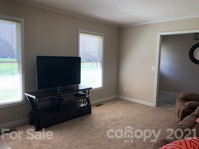 130 Lyn Road Salisbury, NC 28147 - Photo 3 of 15 a living room with furniture and a flat screen tv