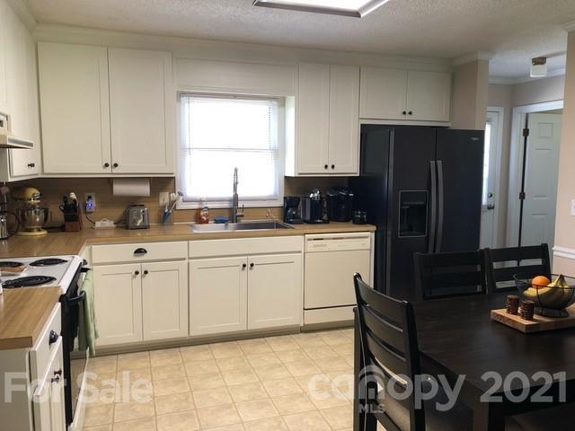 130 Lyn Road Salisbury, NC 28147 - Photo 6 of 15 a kitchen with a sink window and cabinets