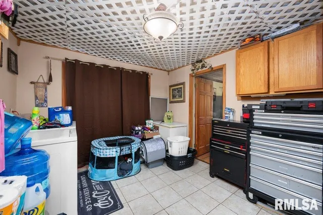 a kitchen with stainless steel appliances kitchen island granite countertop a refrigerator and a stove