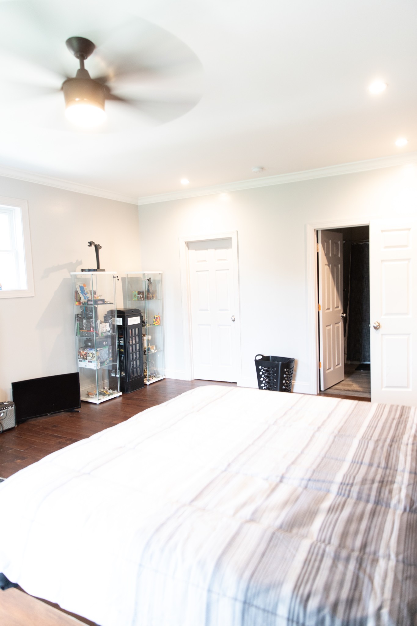 857 Hicks Cut Road Pulaski, TN 38478 - Photo 32 of 49 a large bedroom with a bed and a chandelier