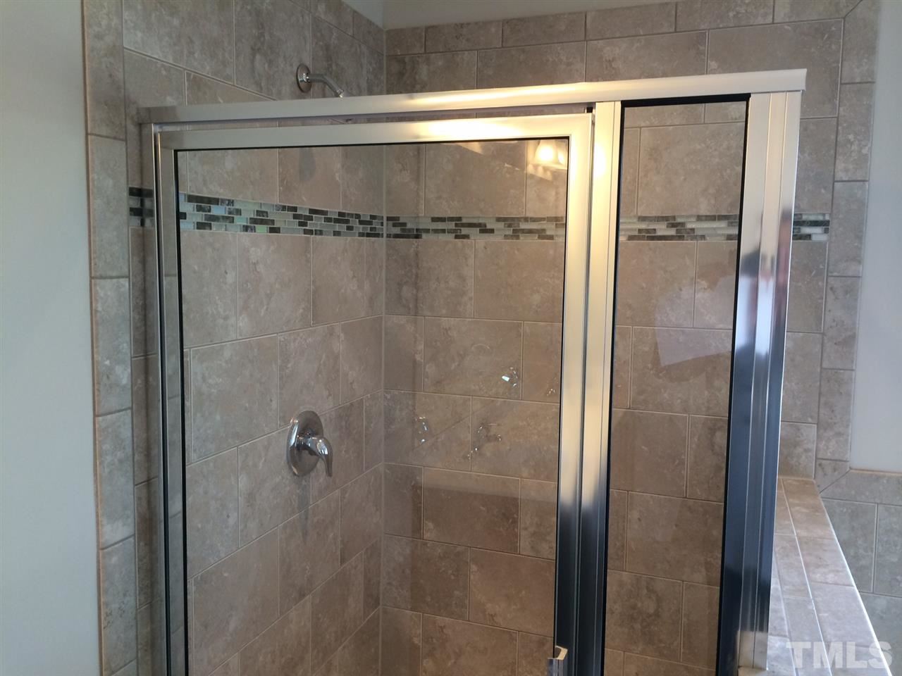 7621 Channery Way Raleigh, NC 27616 - Photo 11 of 25 open and tiled, now we will look forward to showering more