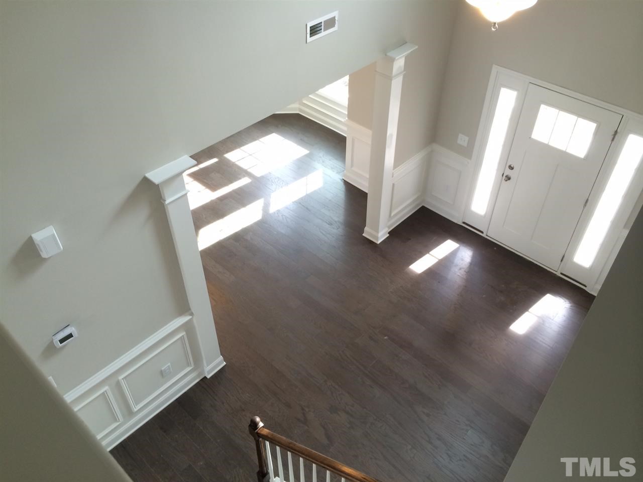 7621 Channery Way Raleigh, NC 27616 - Photo 3 of 25 the WOW factor that greets your family and guest. the wainscoting really makes the entrance stand out