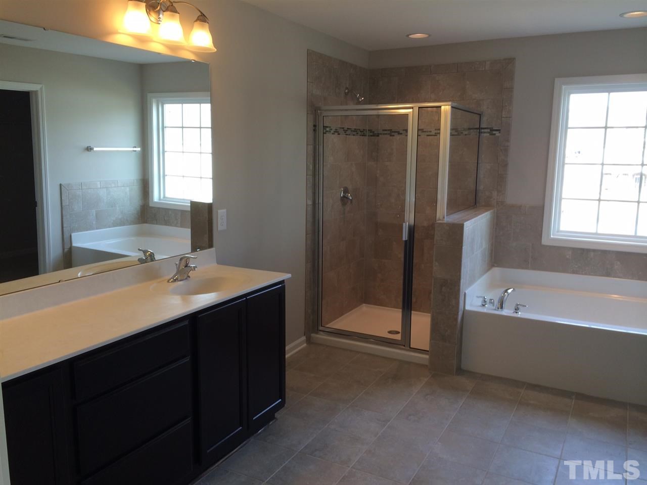 7621 Channery Way Raleigh, NC 27616 - Photo 10 of 25 this master bath is waiting on you with it's tile floors and cultured marble counter tops