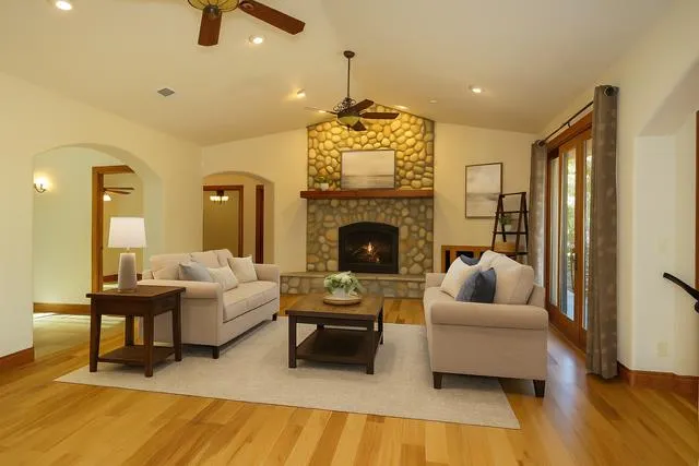 a view of a dining room with furniture and chandelier