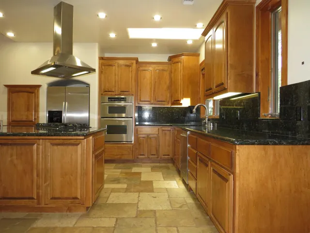 a view of a livingroom with a fireplace and wooden floor