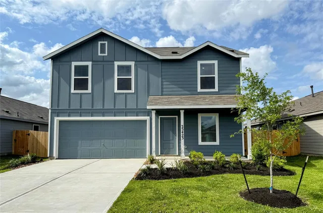 a kitchen with a refrigerator a stove top oven and cabinets