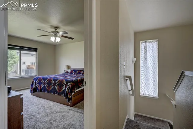 a bed room with a bed and a chandelier
