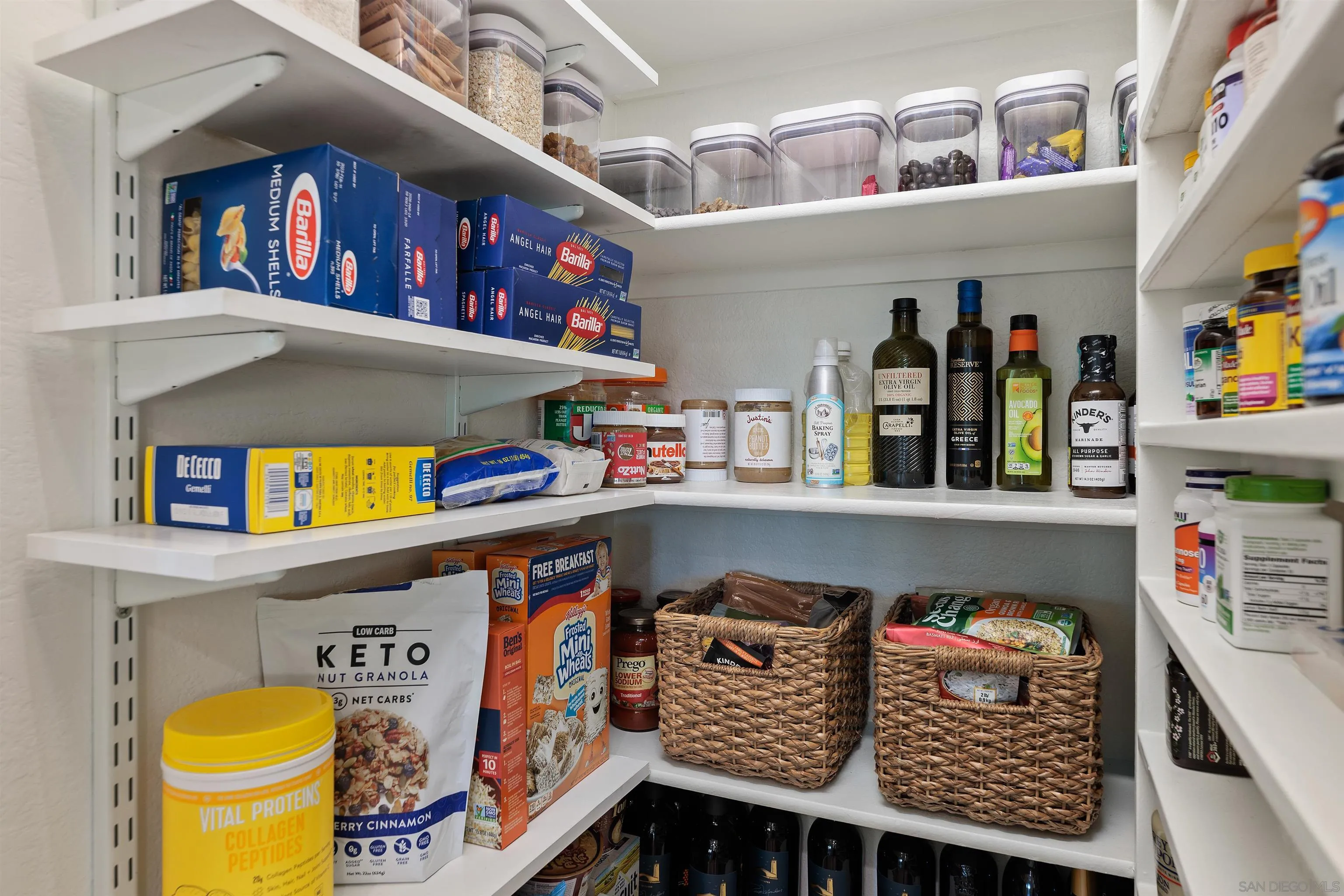 1611 Stoneridge Circle Escondido, CA 92029 - Photo 12 of 30 a living room with baby crib and a wooden floor