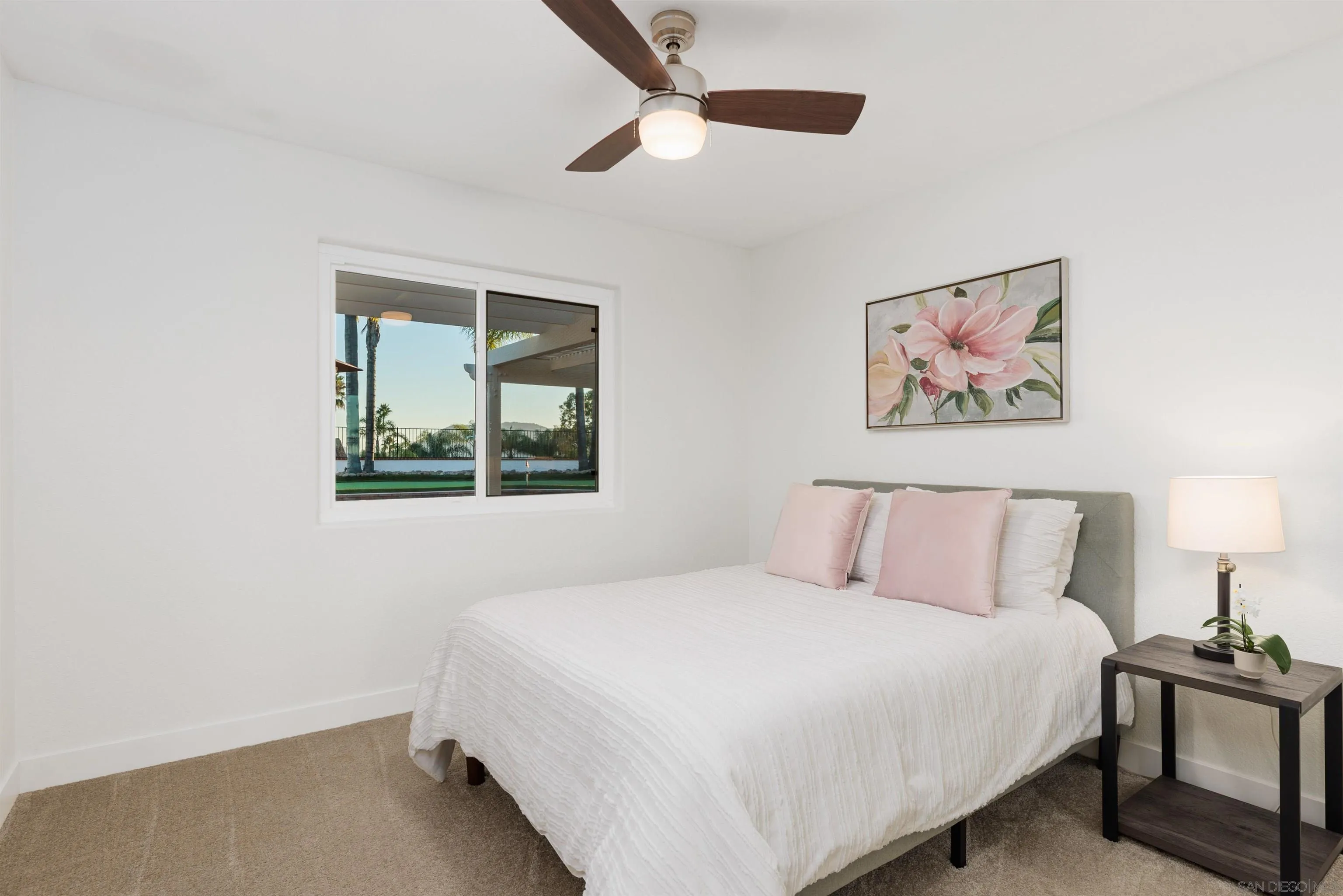 1611 Stoneridge Circle Escondido, CA 92029 - Photo 19 of 30 a bedroom with a large bed and a window