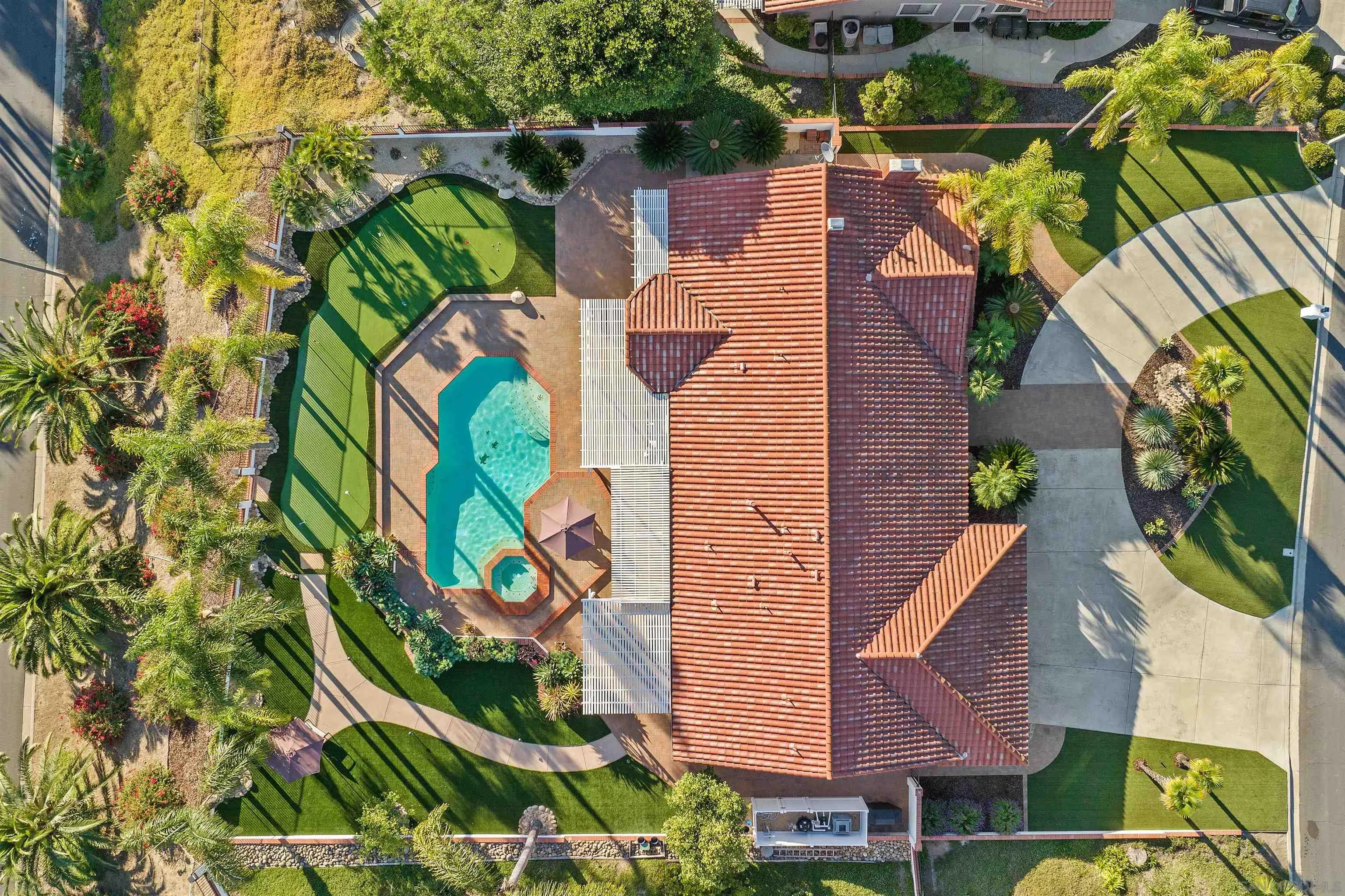 1611 Stoneridge Circle Escondido, CA 92029 - Photo 2 of 30 an aerial view of a house with a yard and potted plants