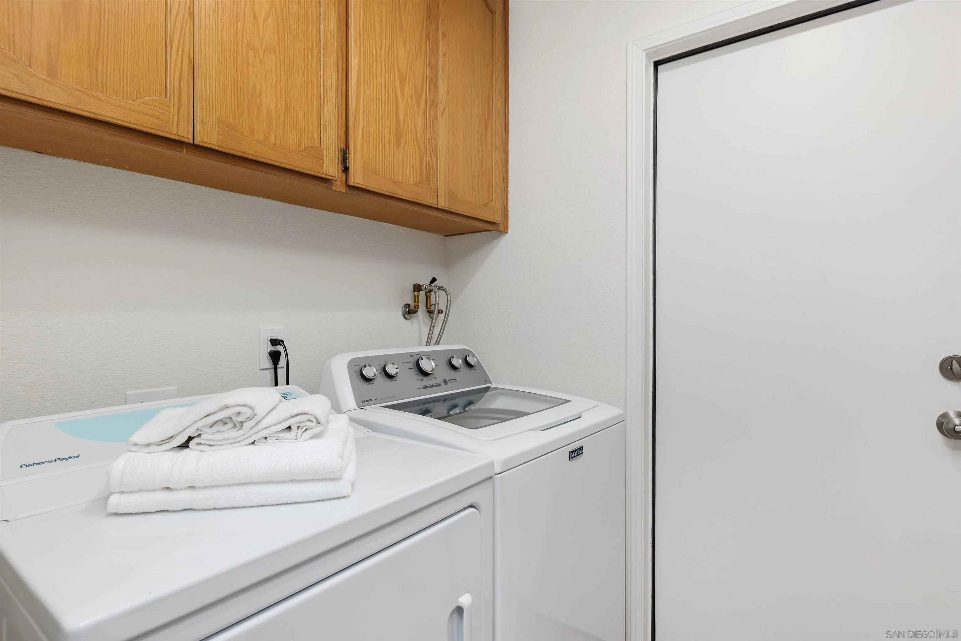 1611 Stoneridge Circle Escondido, CA 92029 - Photo 21 of 30 a utility room with dryer and washer