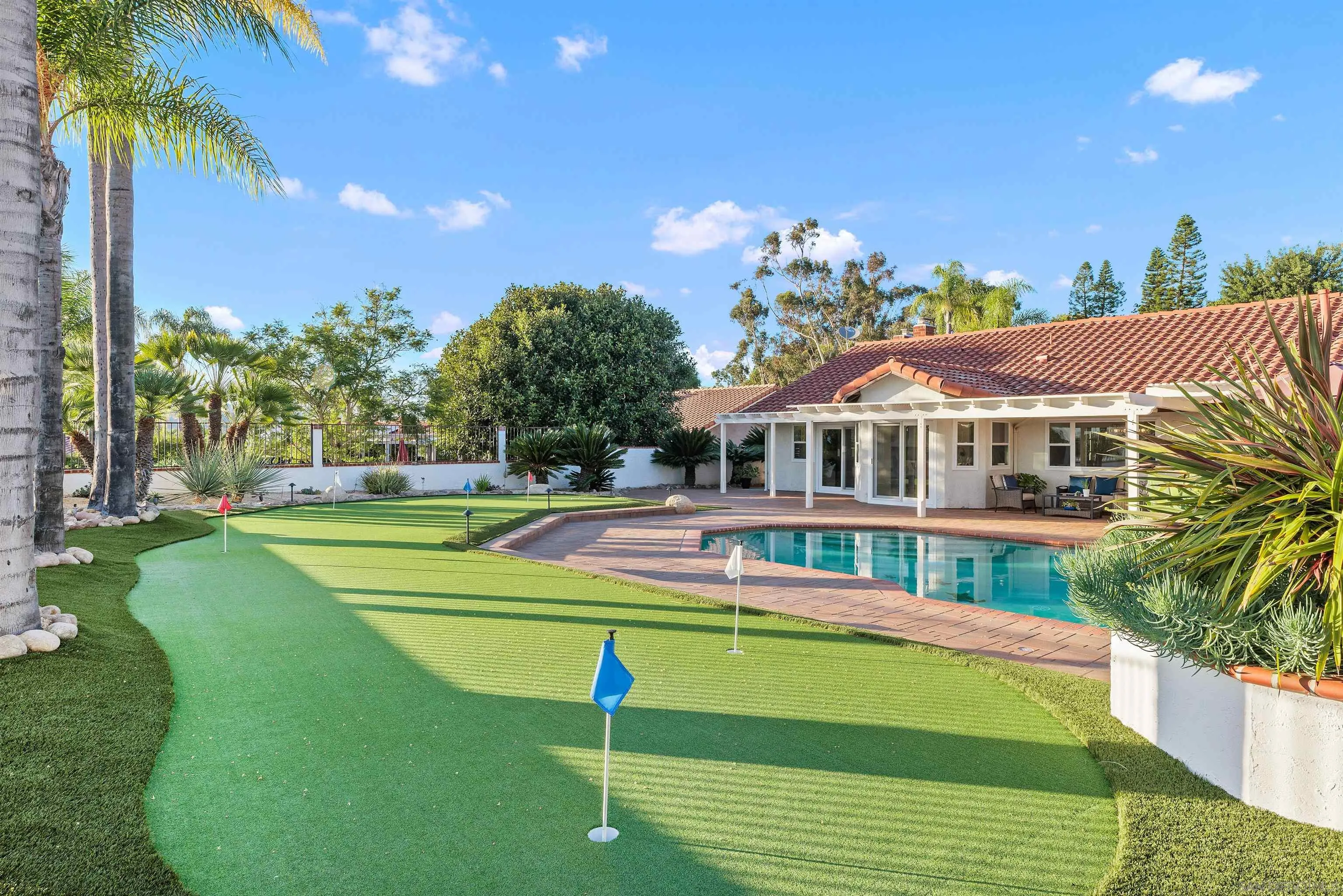 1611 Stoneridge Circle Escondido, CA 92029 - Photo 24 of 30 a view of swimming pool with outdoor seating and trees in the background