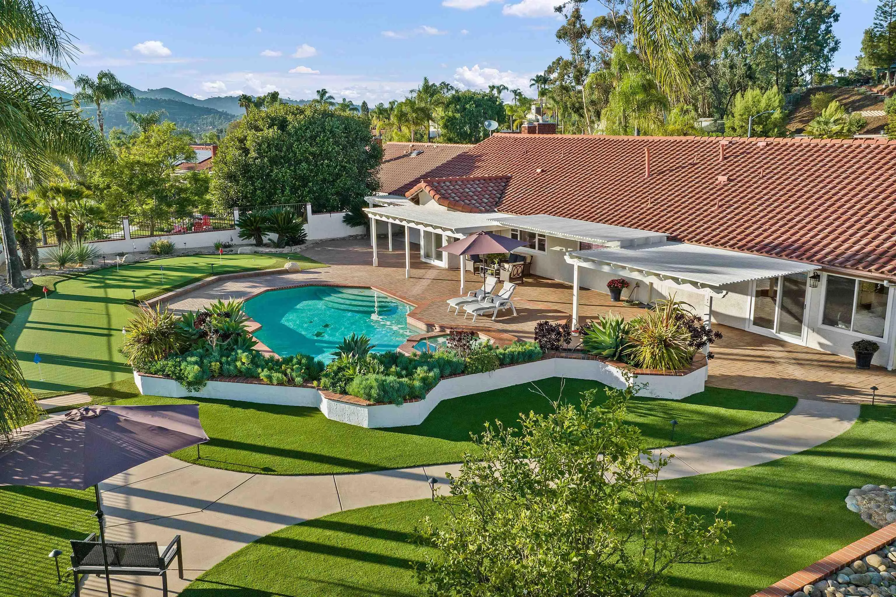 1611 Stoneridge Circle Escondido, CA 92029 - Photo 4 of 30 an aerial view of a house with a garden