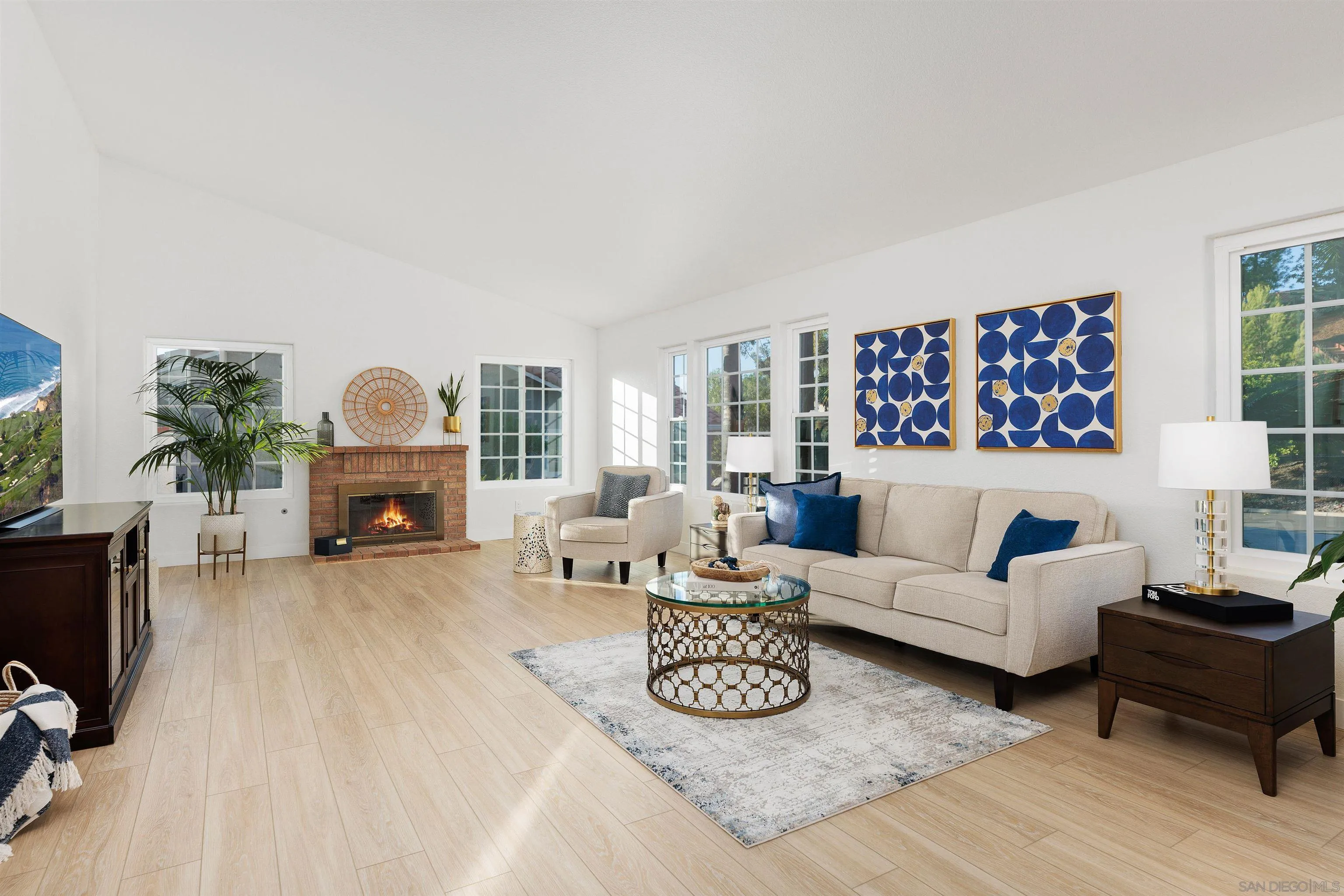 1611 Stoneridge Circle Escondido, CA 92029 - Photo 7 of 30 a living room with furniture a fireplace and a flat screen tv