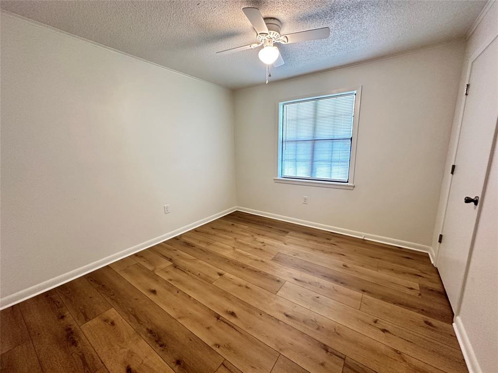 127 Lawrence Drive Haughton, LA 71037 - Photo 11 of 16 wooden floor in an empty room with a window