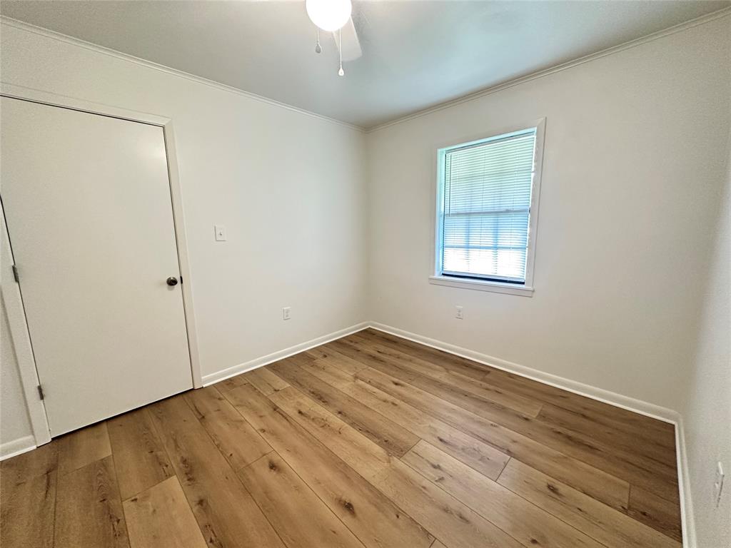 127 Lawrence Drive Haughton, LA 71037 - Photo 5 of 16 an empty room with wooden floor and windows