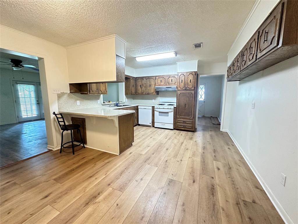 127 Lawrence Drive Haughton, LA 71037 - Photo 6 of 16 a view of kitchen with cabinets and wooden floor