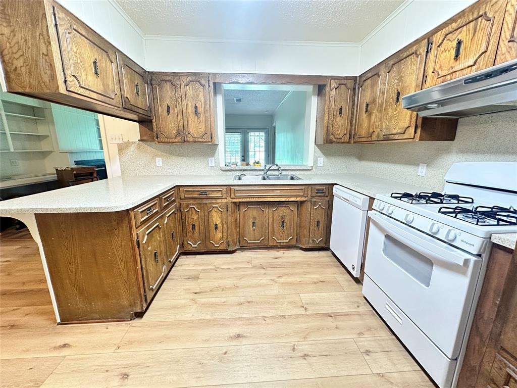 127 Lawrence Drive Haughton, LA 71037 - Photo 7 of 16 a kitchen with stainless steel appliances granite countertop a stove and a sink