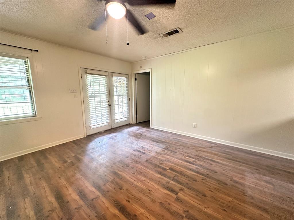 127 Lawrence Drive Haughton, LA 71037 - Photo 8 of 16 an empty room with wooden floor and windows