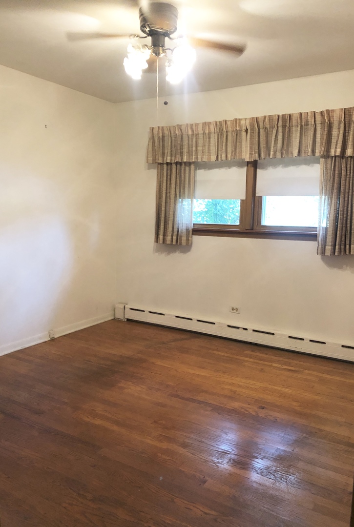 3449 Phillips Avenue Steger, IL 60475 - Photo 16 of 25 a view of a room with wooden floor