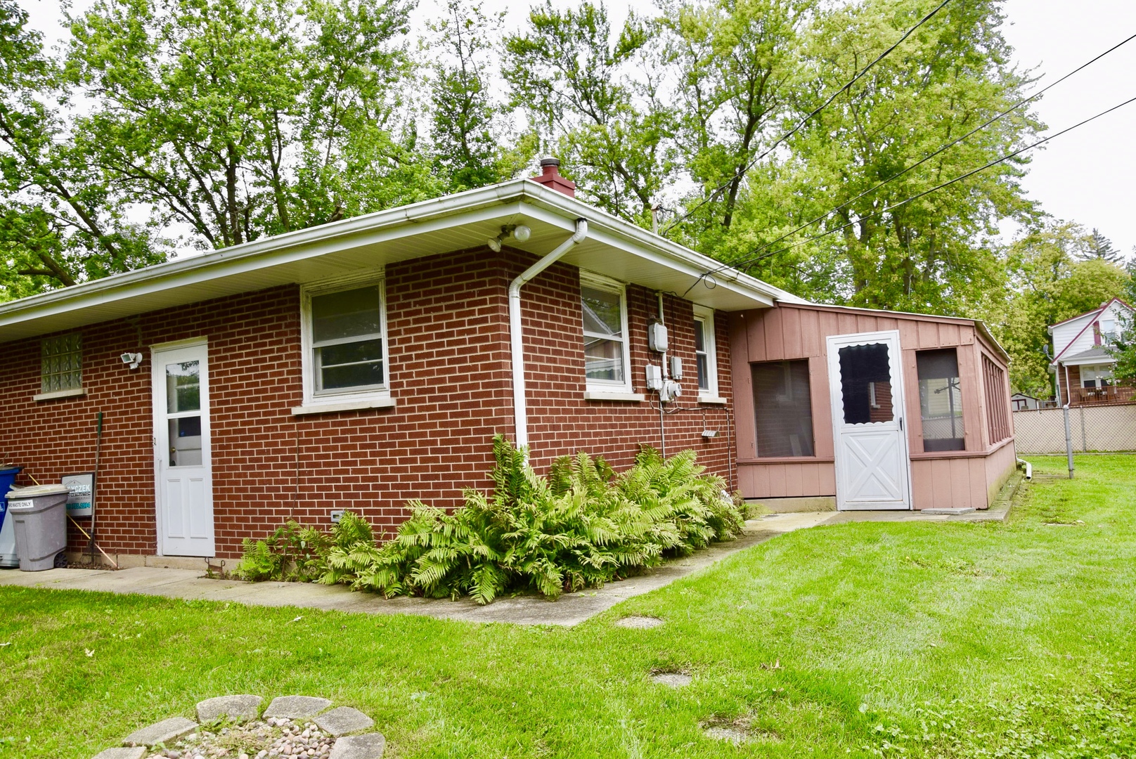 3449 Phillips Avenue Steger, IL 60475 - Photo 17 of 25 a front view of a house with a garden